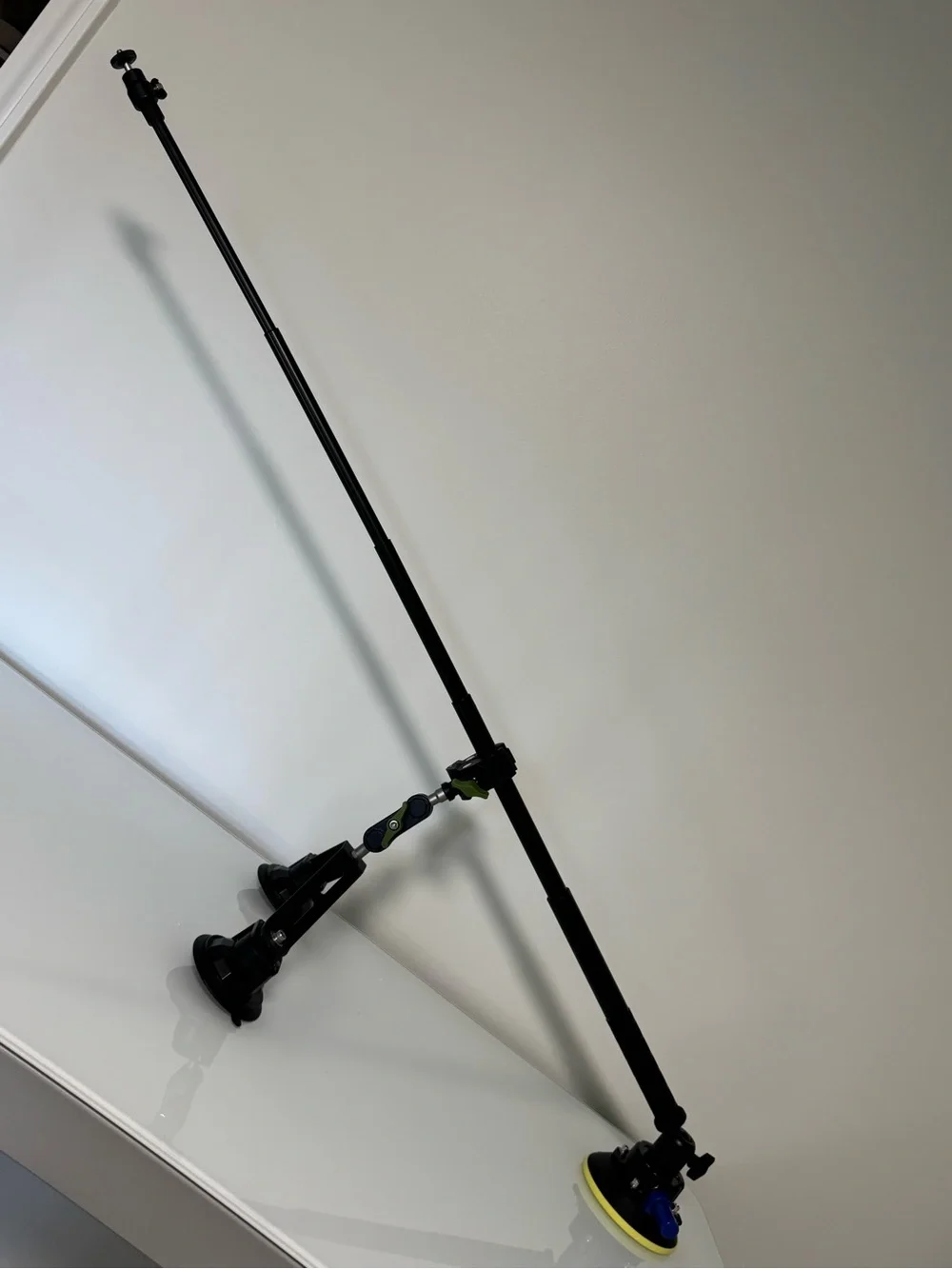 Adjustable Black Camera Mounting Arm with Green Accents